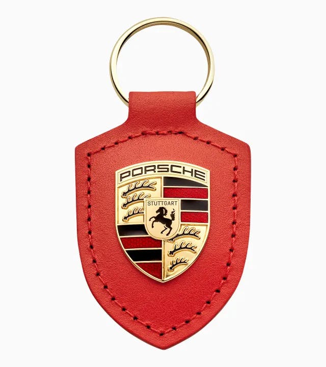 Porta-chaves com escudo "Driven by Dreams" – 75 anos