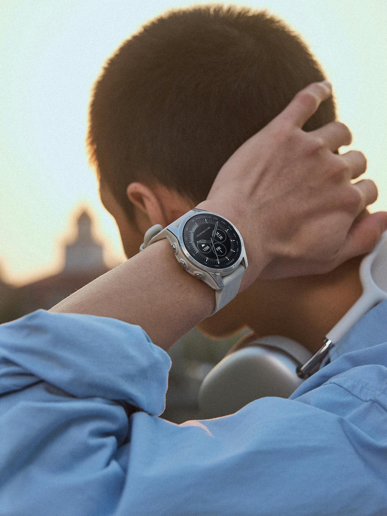 Man is wearing a Porsche x Garmin Epix Pro Smartwatch