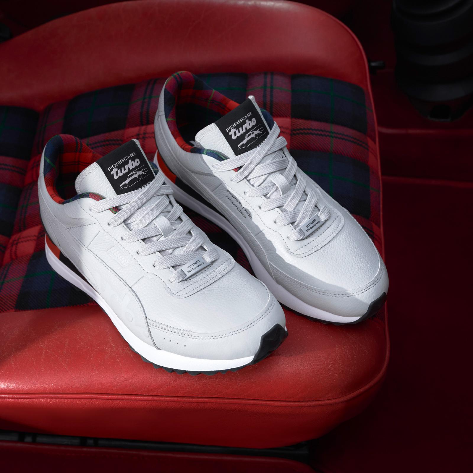 A pair of new 50Y Turbo sneaker on a red car chair