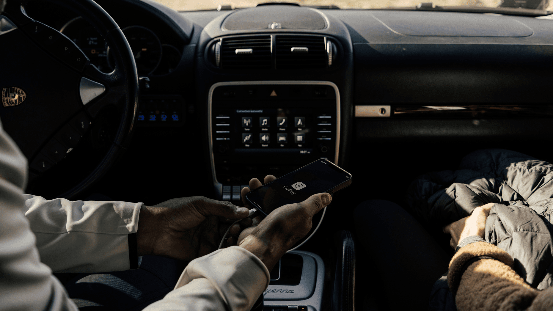 You can see two persons in a car with focus on the PCCM system