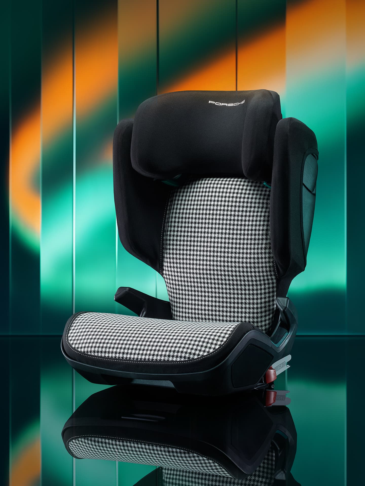 Child seat in the focus with a green and orange background