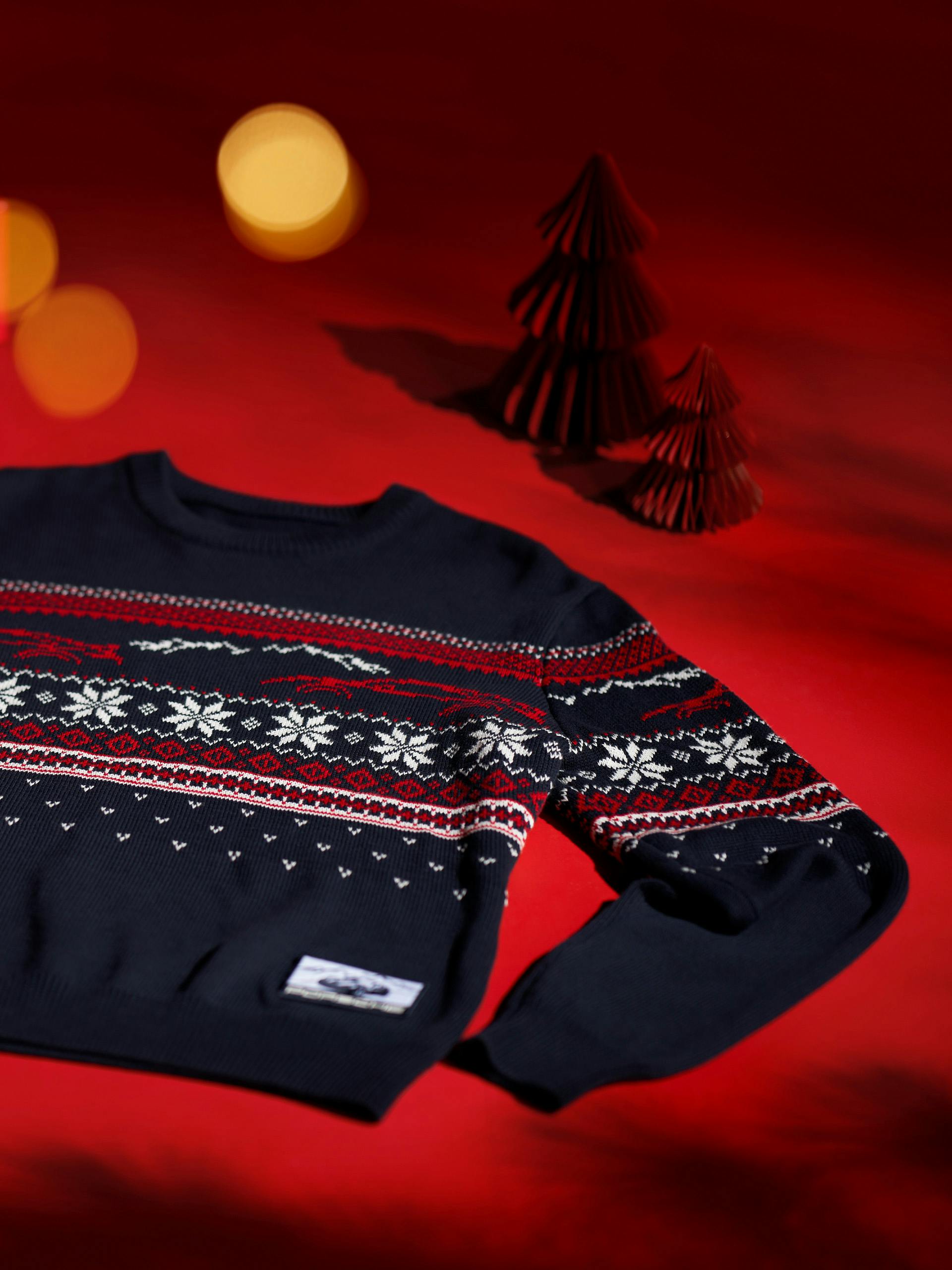 Porsche Christmas knitted pullover on a red background