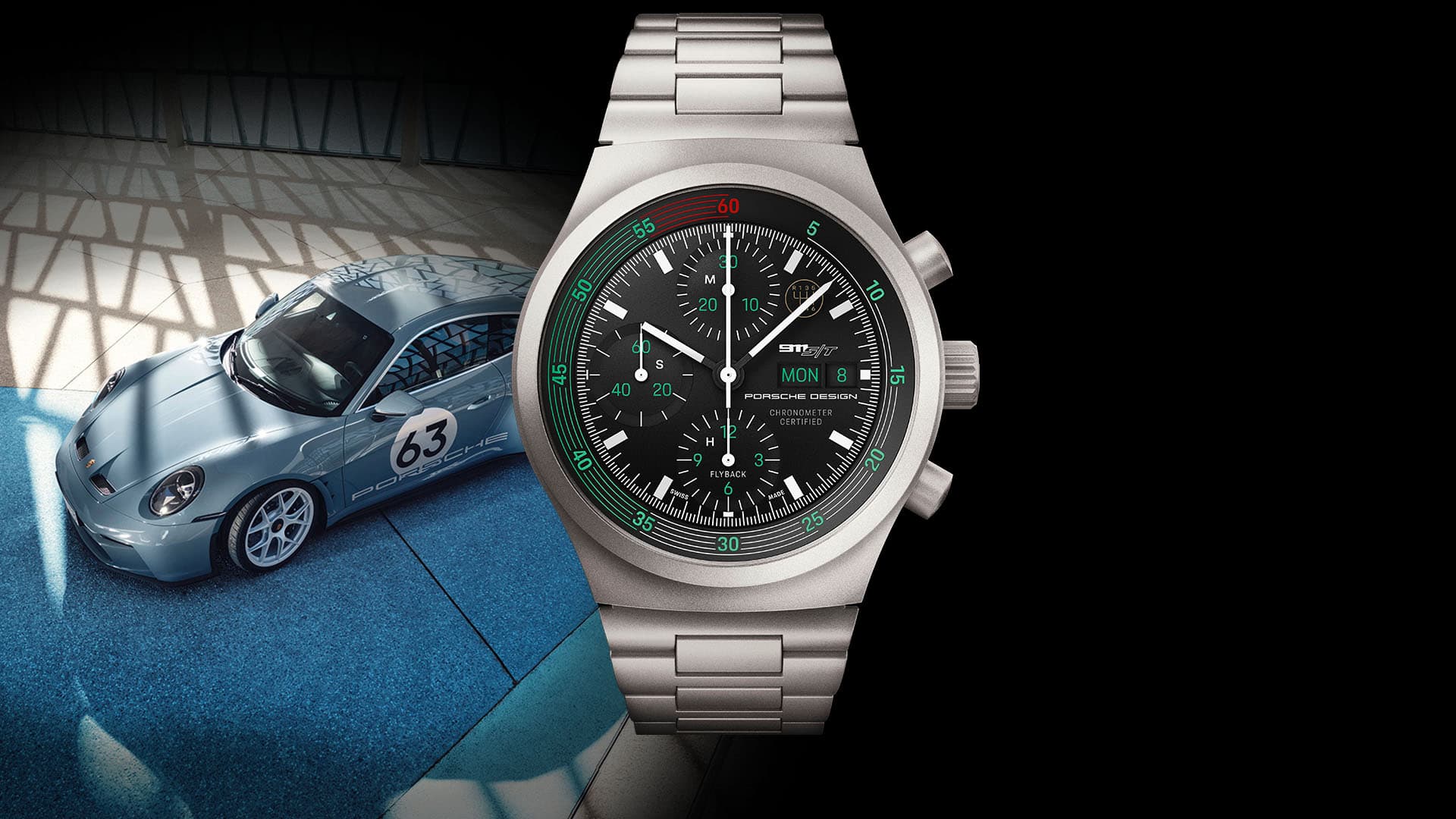 Silberne Porsche Design Chronographenuhr mit schwarzem Zifferblatt, davor ein hellblauer Porsche 911 mit Startnummer 63.