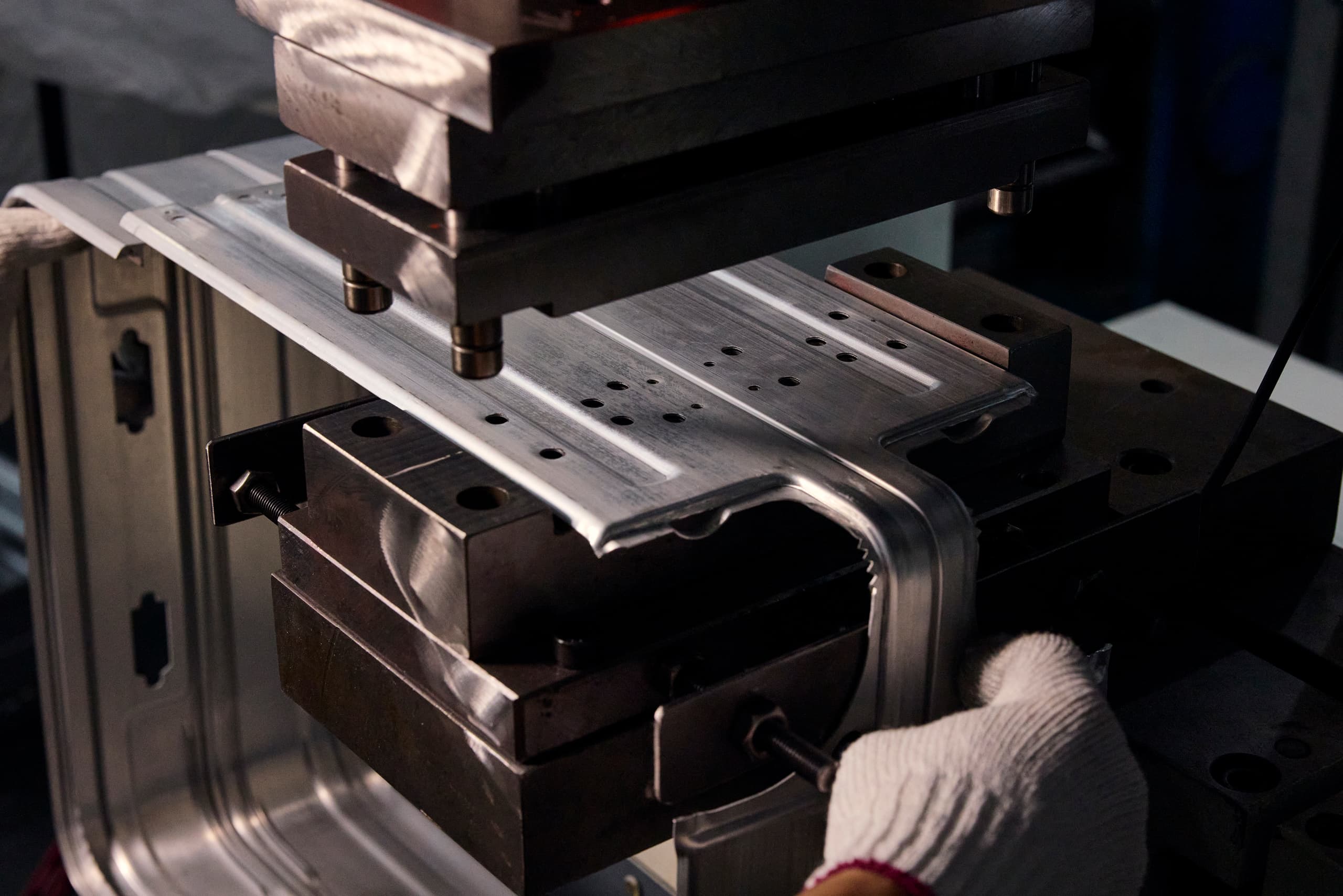 Image shows a production step for bending aluminum for the Roadster Aluminum Trolley.