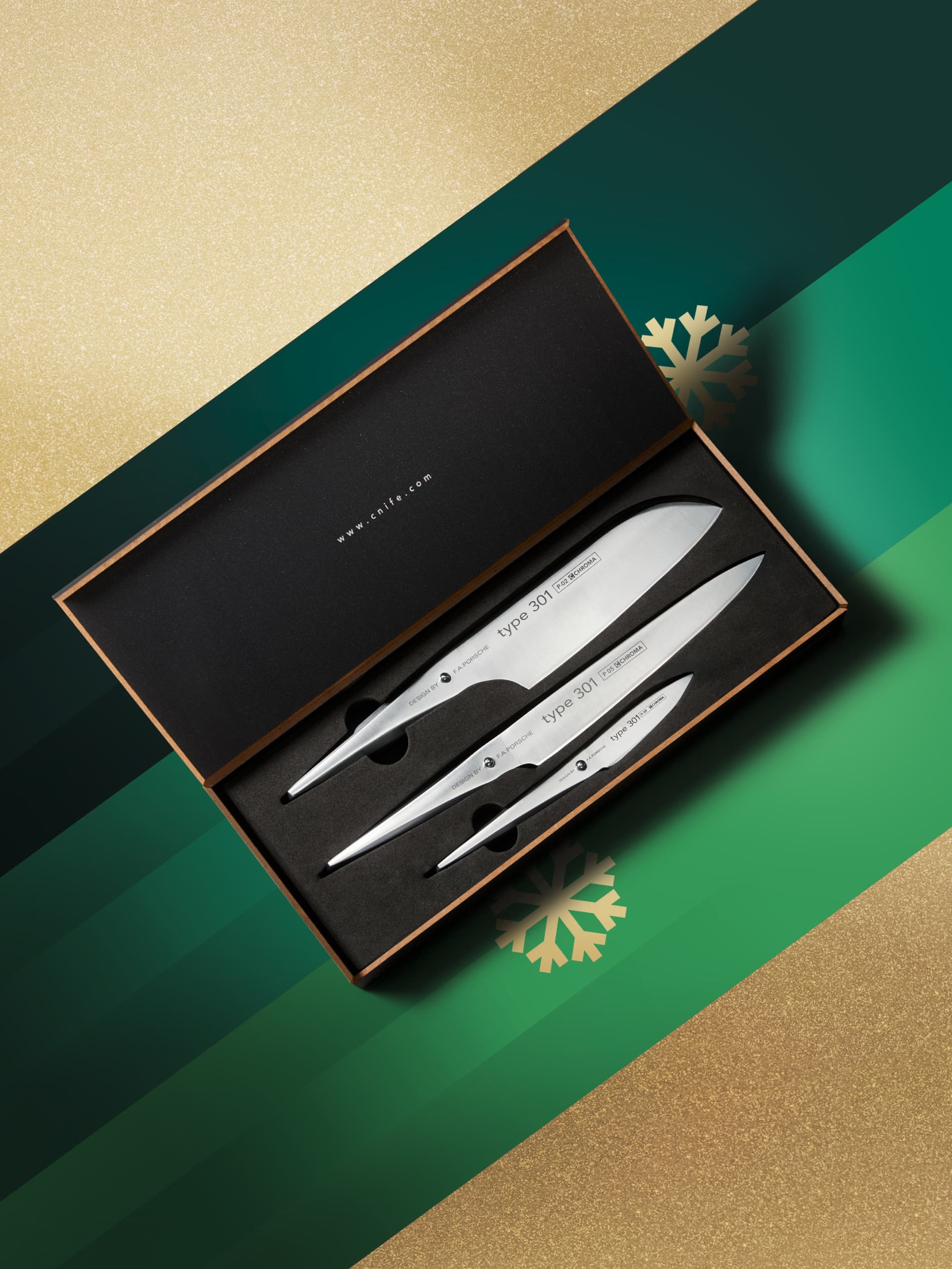 Knive set in decorative box on green and golden background