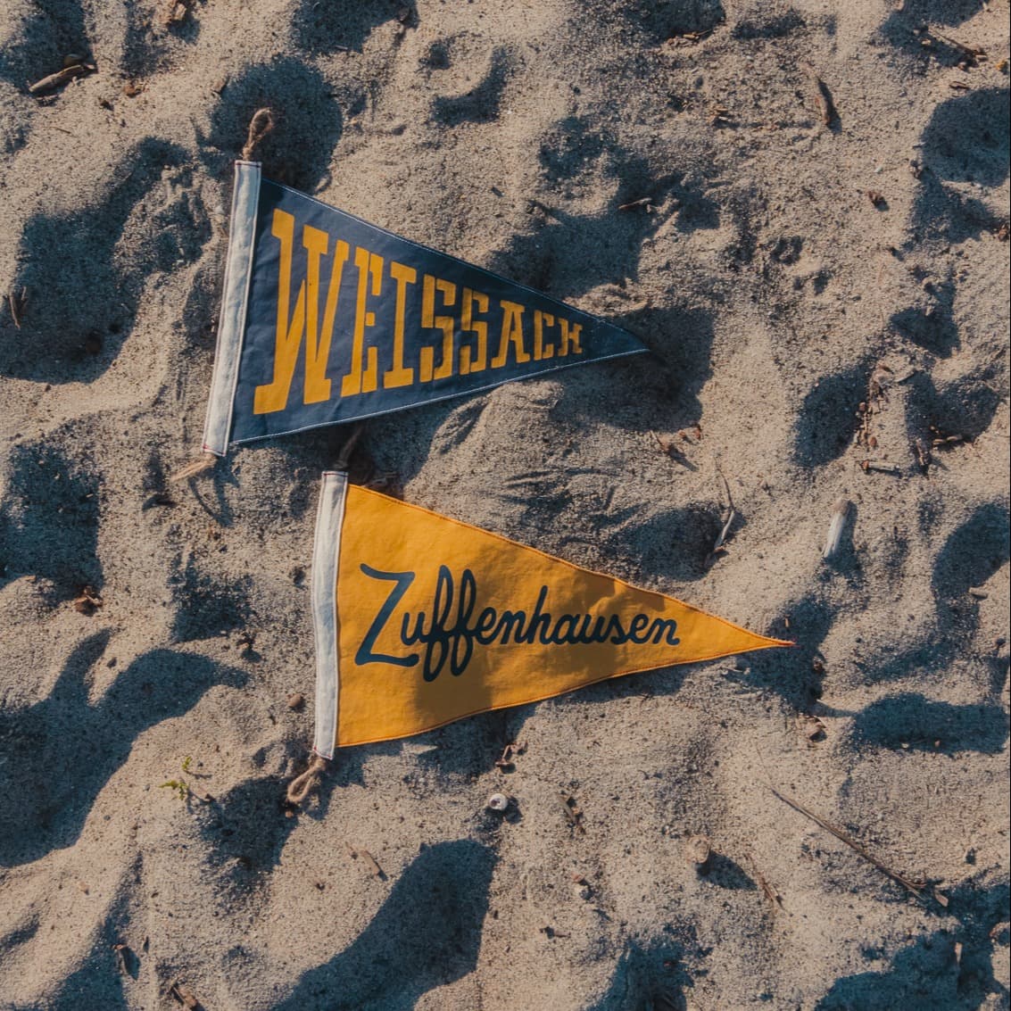 Blue and Yellow Surf Flags on beach