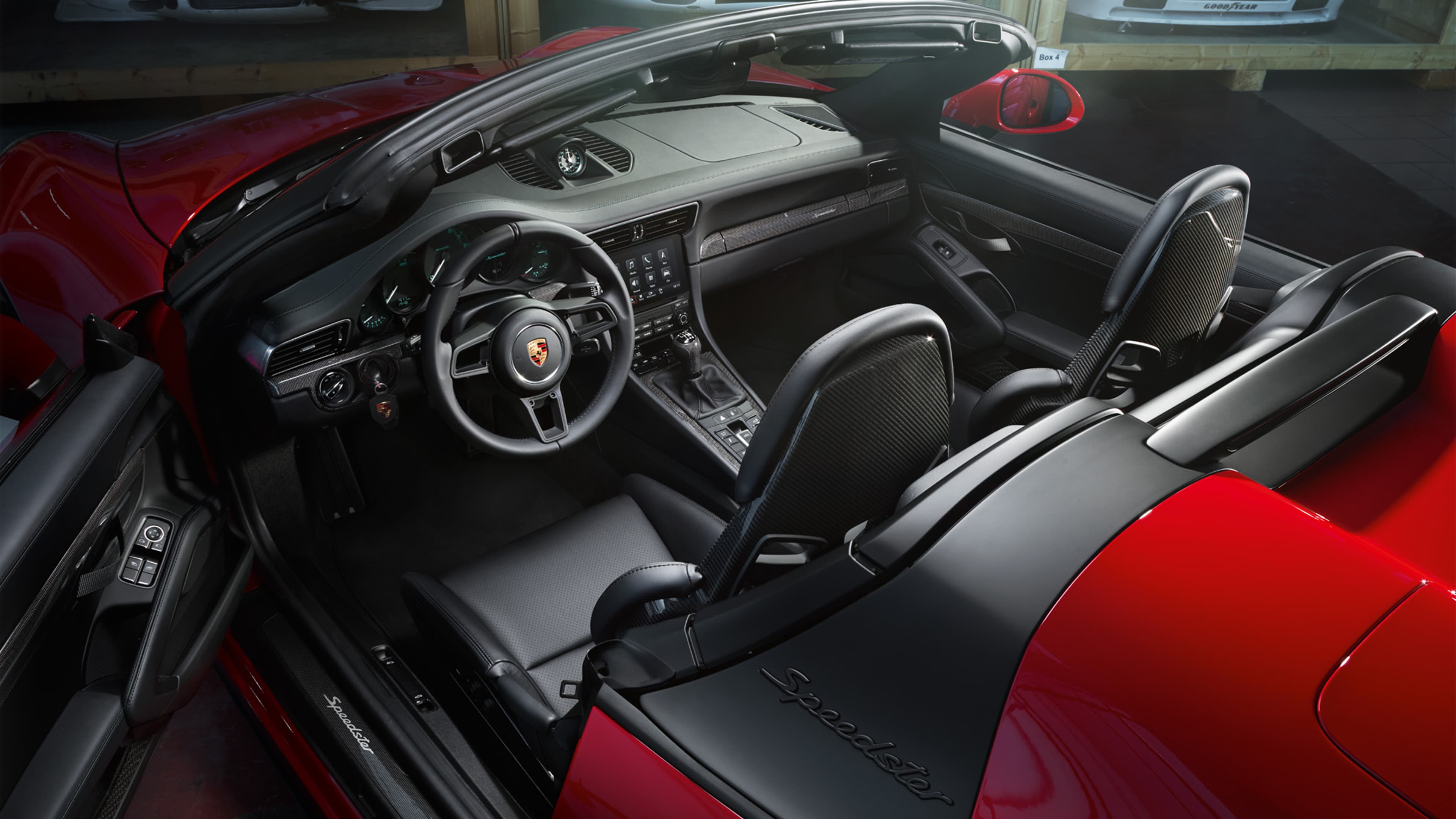 Pictured is a red Porsche 911 Speedster from above
