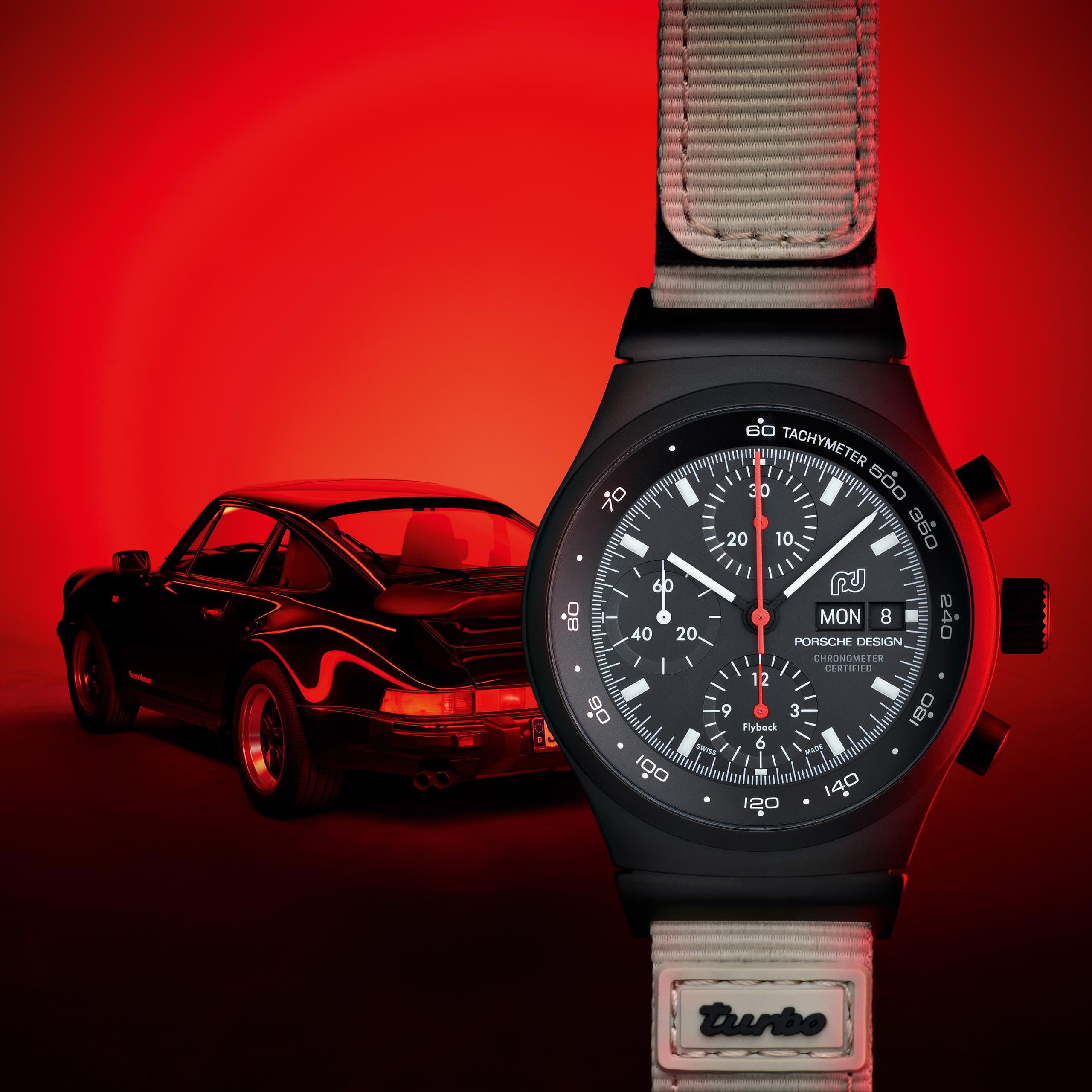 Chronograph 1 - 50 Years 911 Turbo Edition is positioned on the rear spoiler of a Porsche 911 Turbo