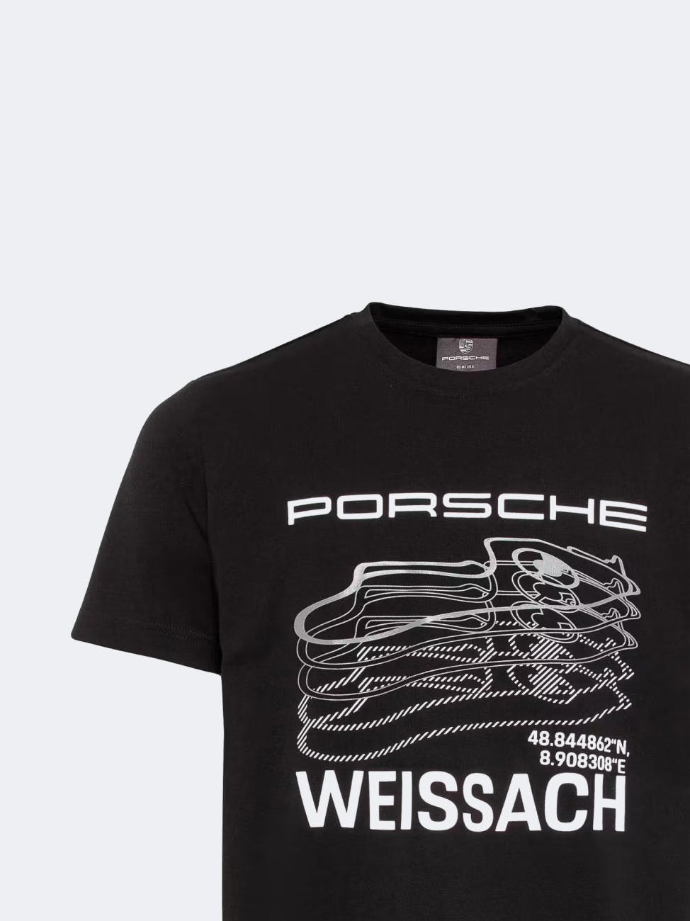 On display is a black T-shirt with a white Porsche lettering