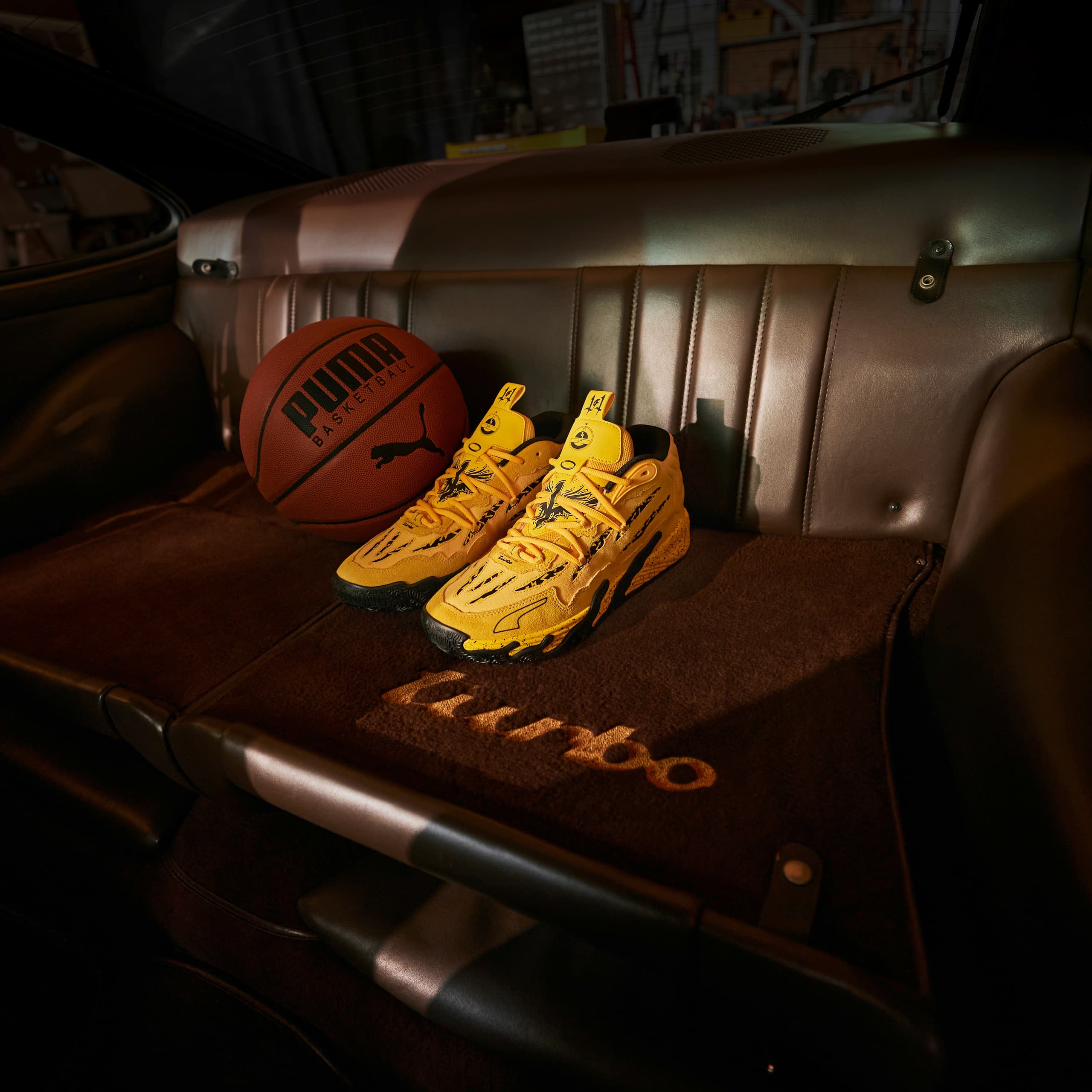 PUMA x LAMELO BALL x PORSCHE placed on rear seats of a Porsche 911