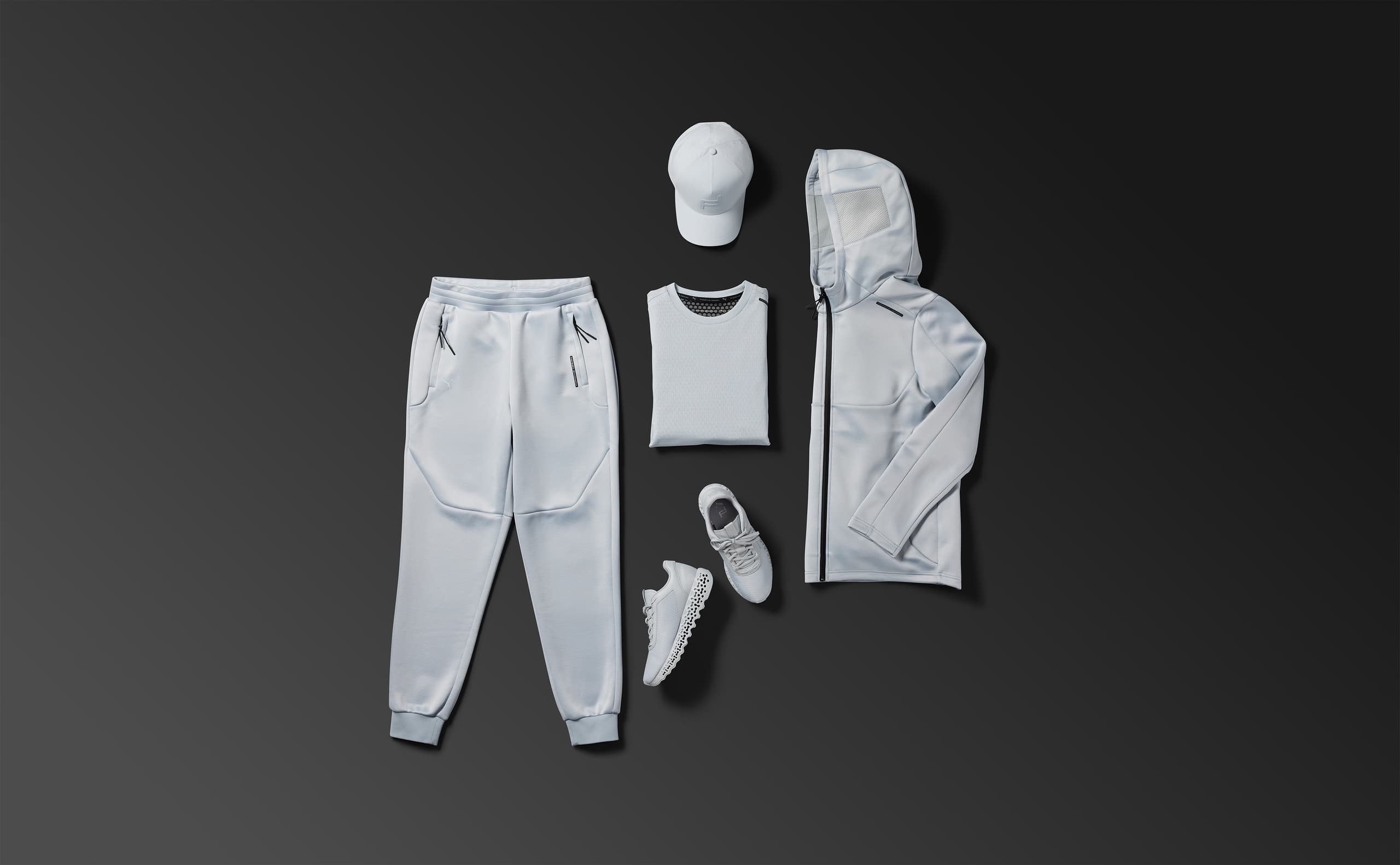 Image shows a flatlay of products from the Fall Winter 2025 collection by Porsche Design.