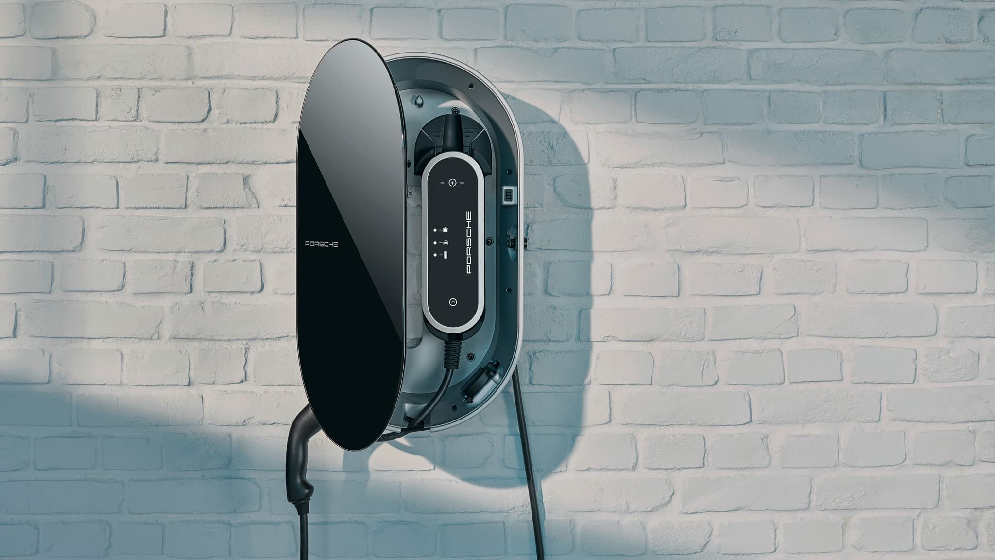 Chargeur mural Porsche sur mur de briques blanches, design noir élégant avec câble visible, esthétique moderne et minimaliste.