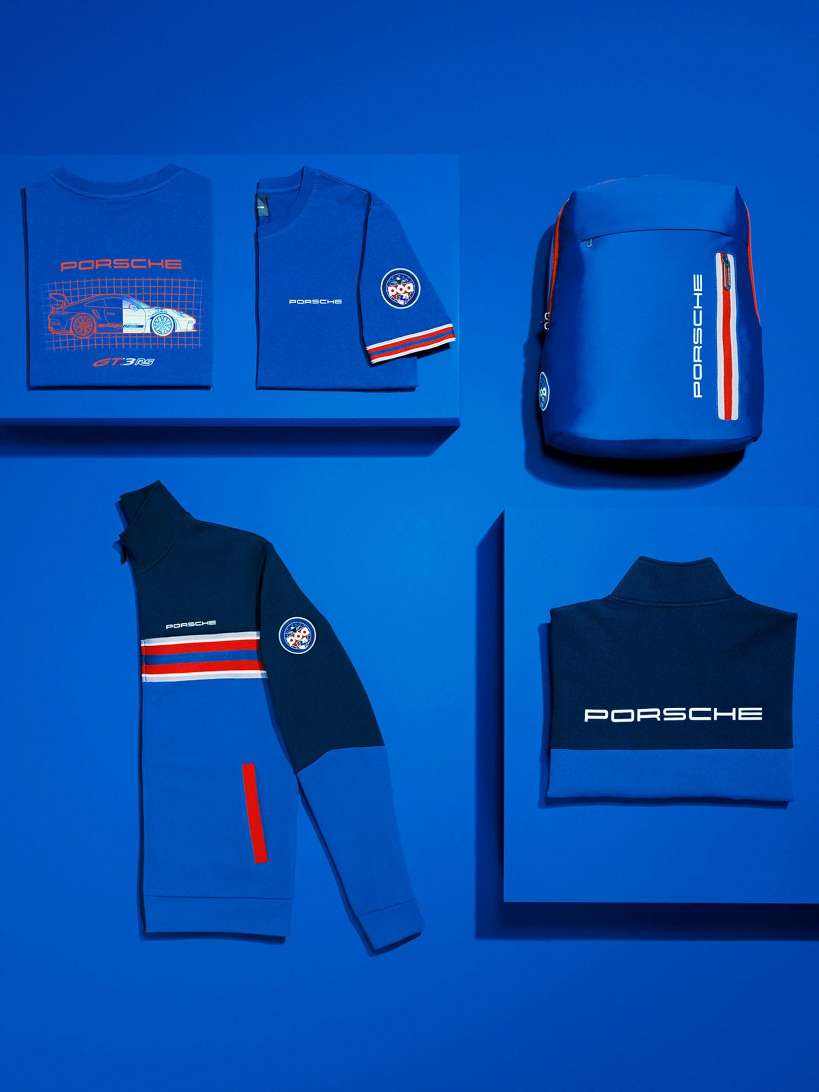 Different products from the new Porsche PCA collection on a blue ground