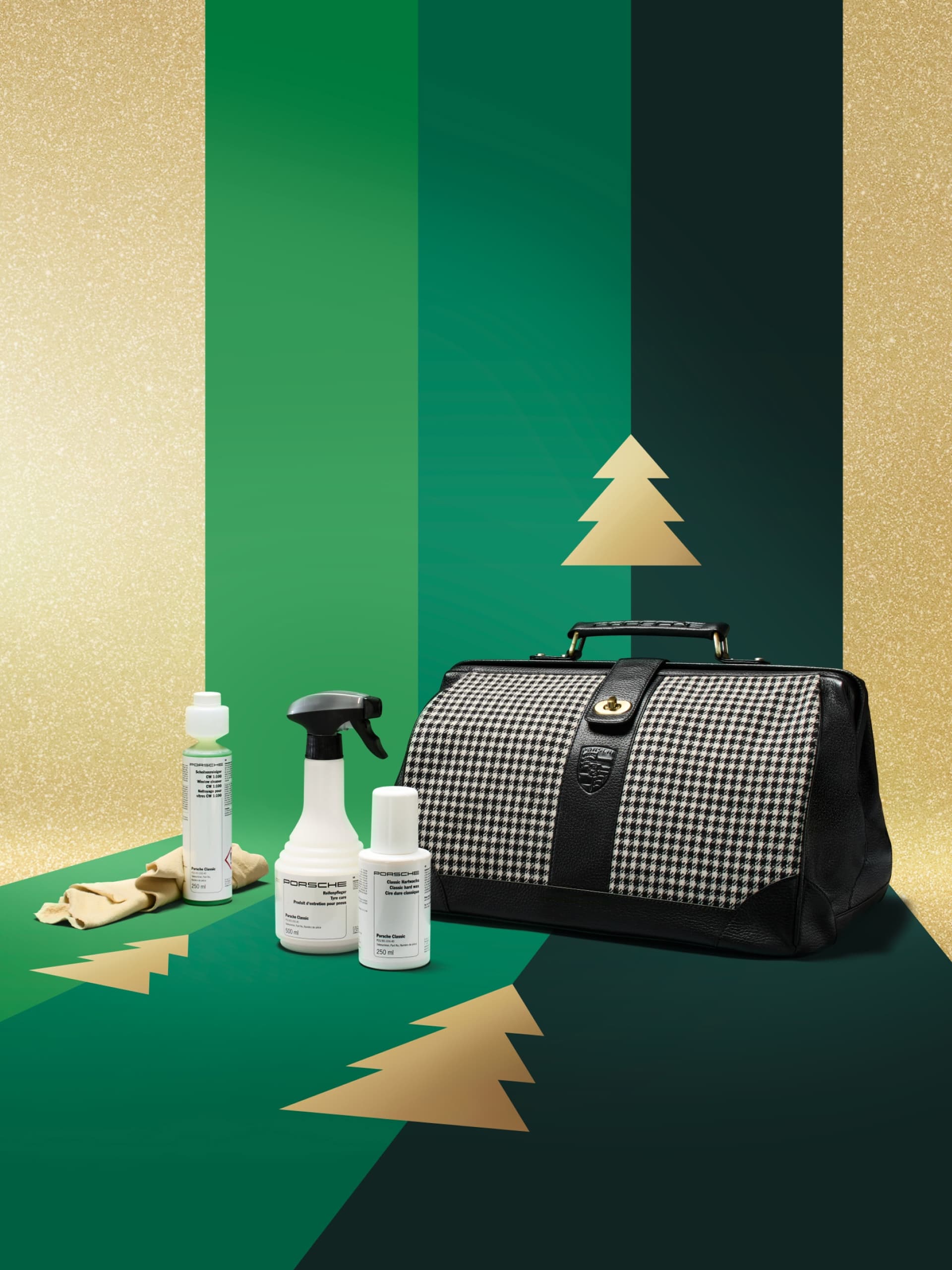 Porsche cleaning kit with houndstooth bag on green and gold background with tree motifs.