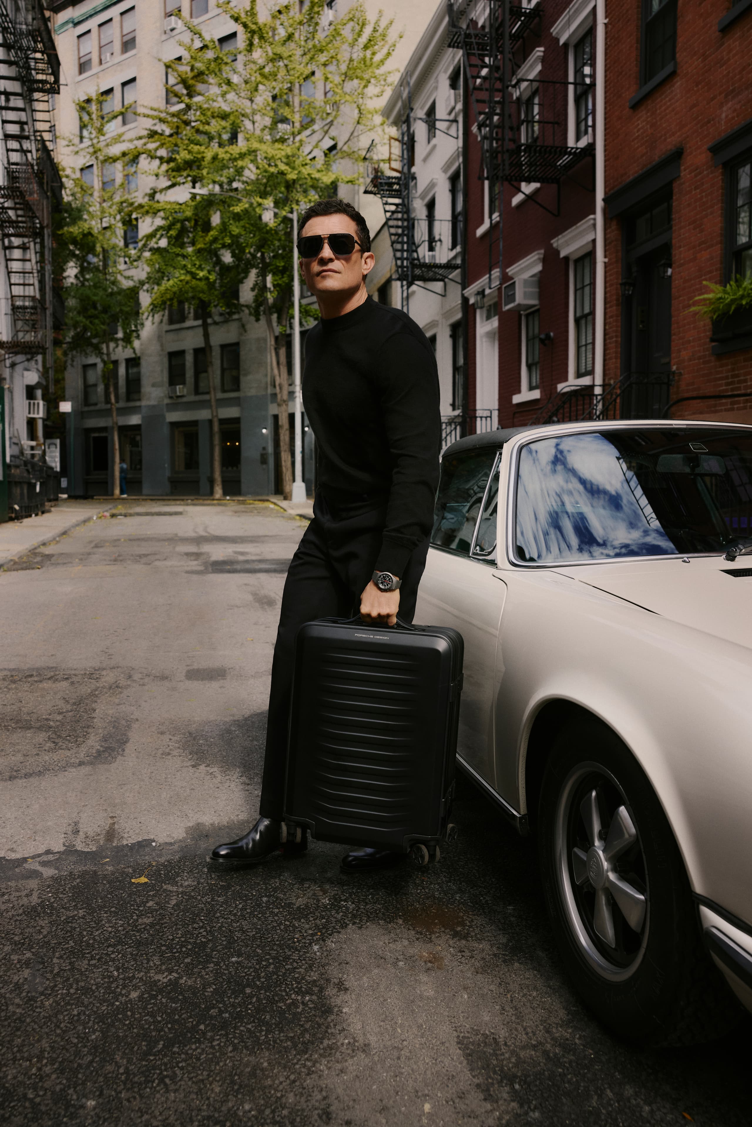 Roadster Aluminum Trolley Cabin Size, Porsche car and man carring other trolley in background