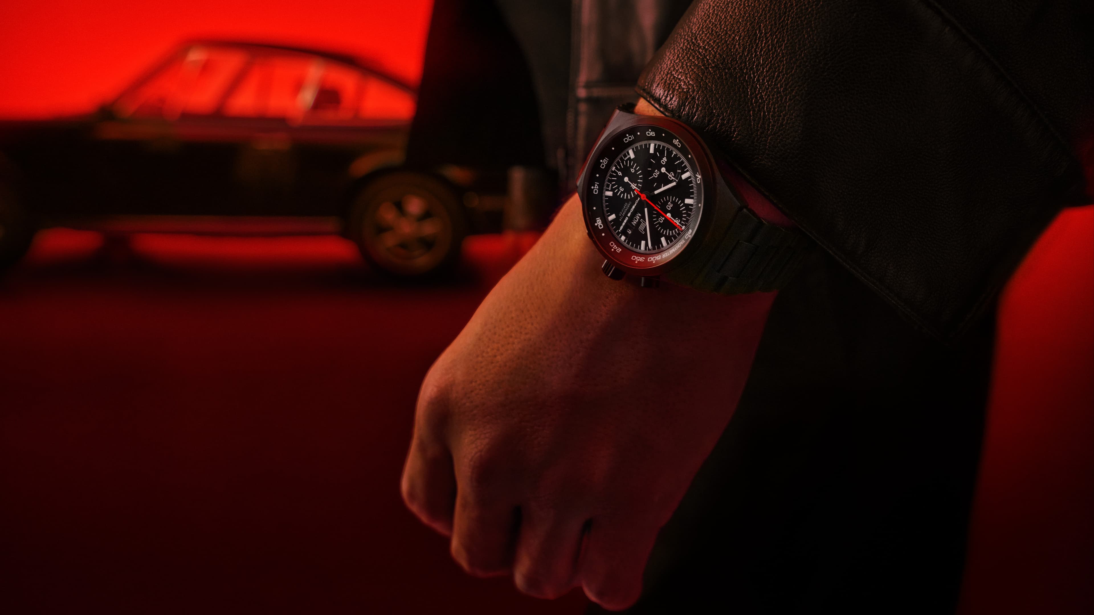 Detail view of Porsche Design custom-build Timepiece with red wristband