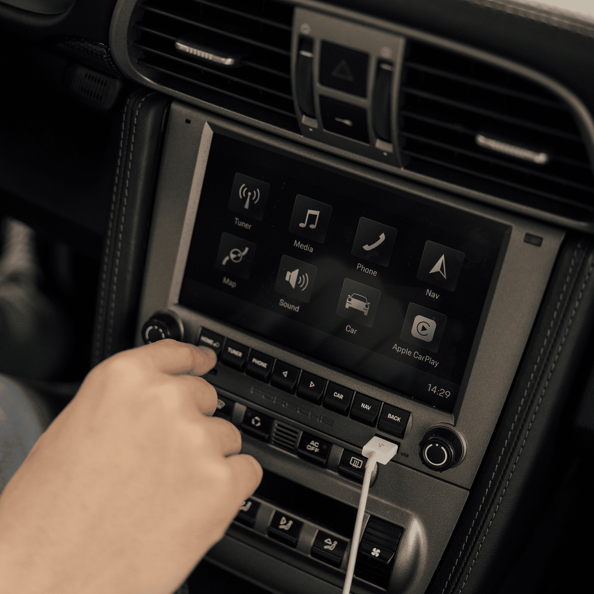 close up of a PCCM system in a car with a hand