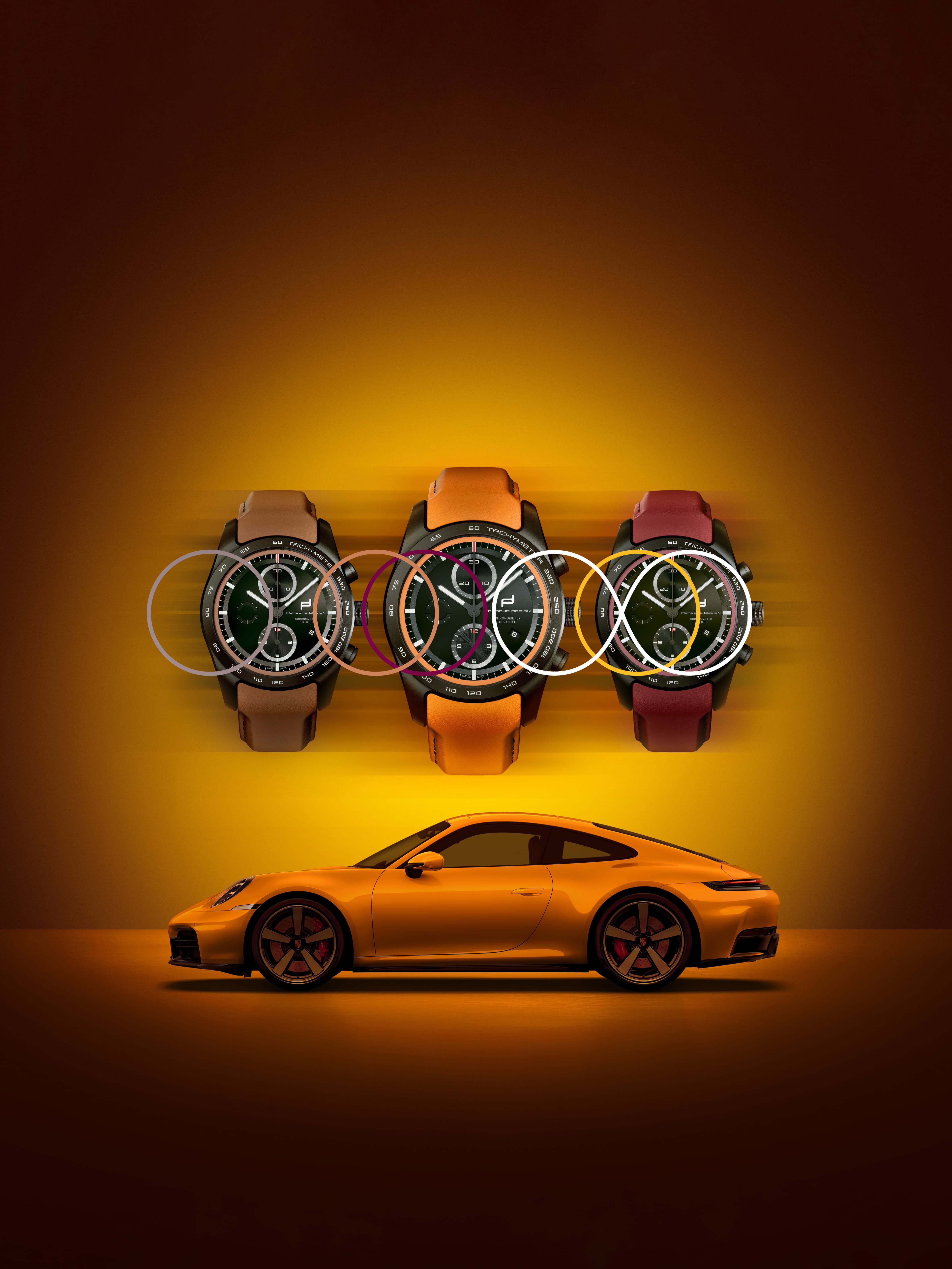 Drei Porsche Design Chronographen mit farbigen Armbändern über einem orangefarbenen Porsche 911 auf gelbem Hintergrund.