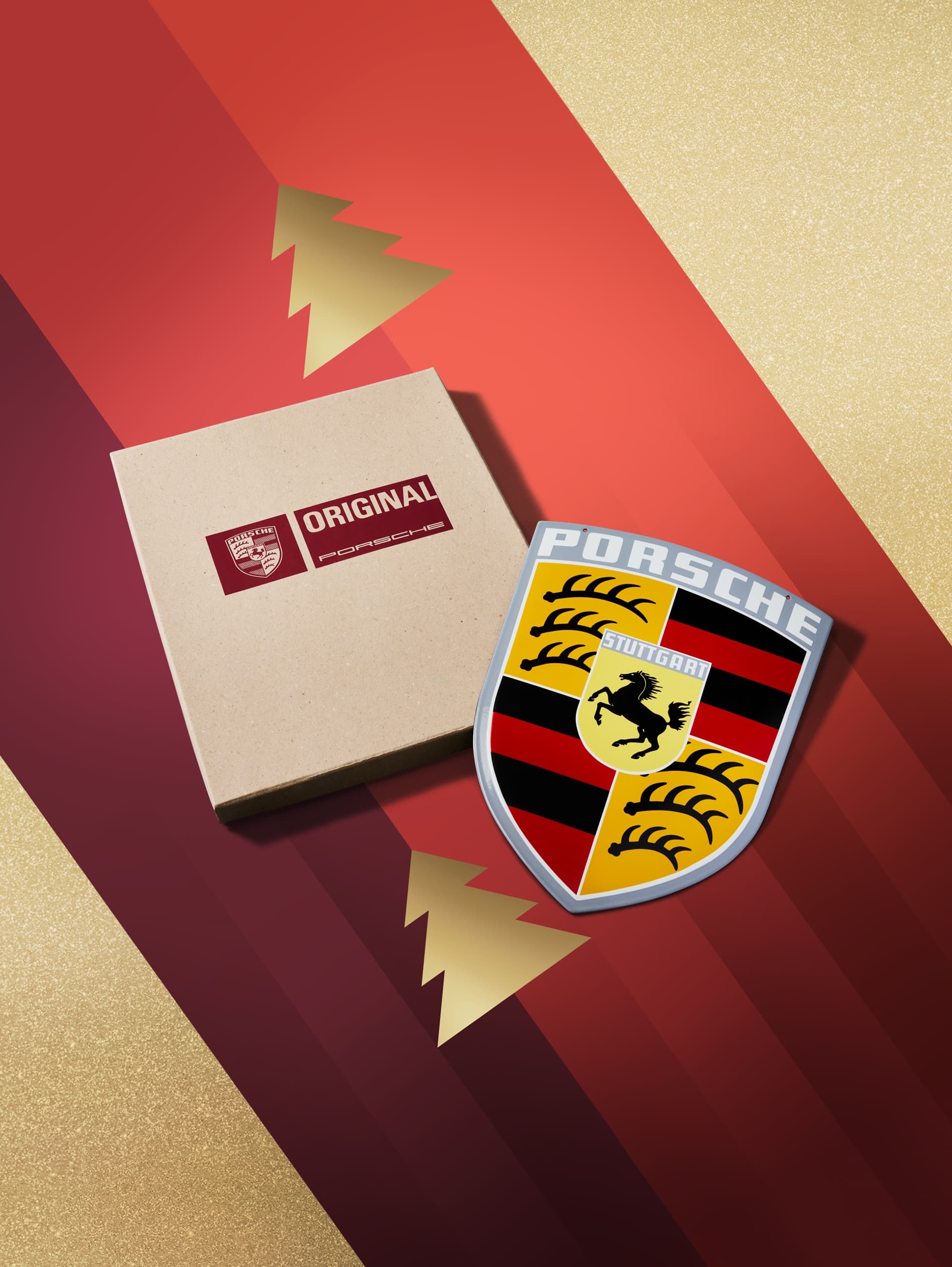 Porsche emblem and branded box on red and gold background with stylized tree design.