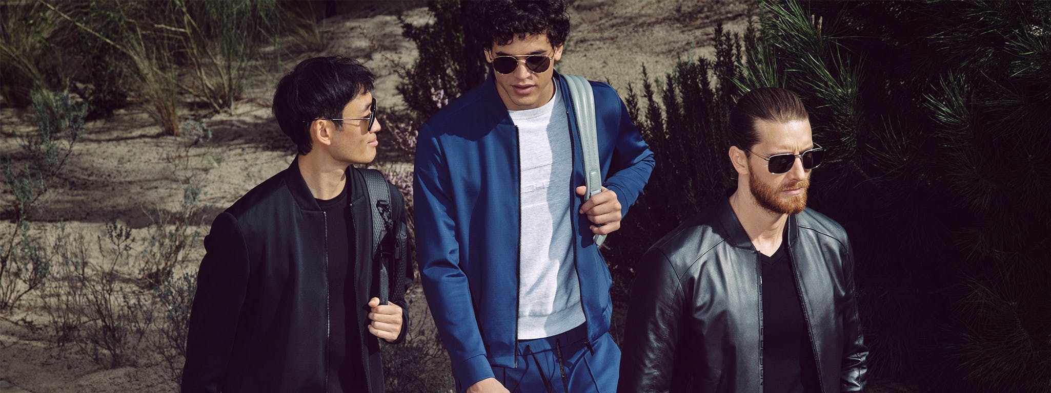 three men modelling outfits and sunglasses