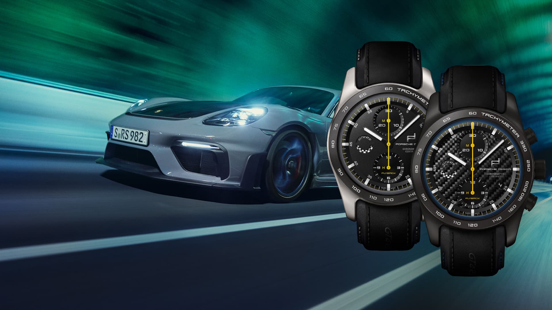 Pictured are two watches from the Chronograph 718 Cayman GT4 RS Edition and in the background is a black and grey Porsche 911