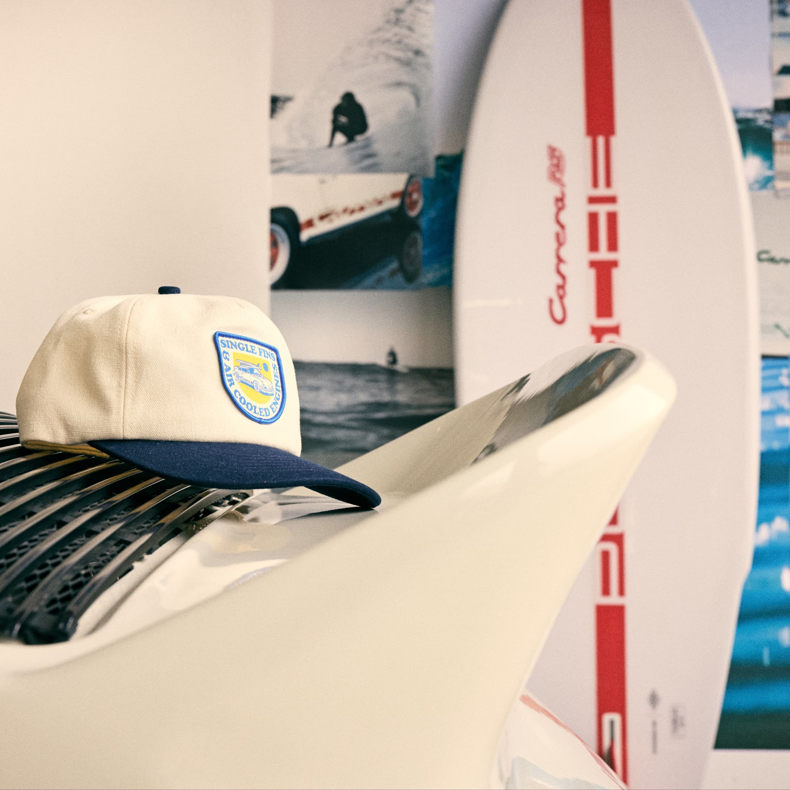 White Surfboard with Red stripe in Garage