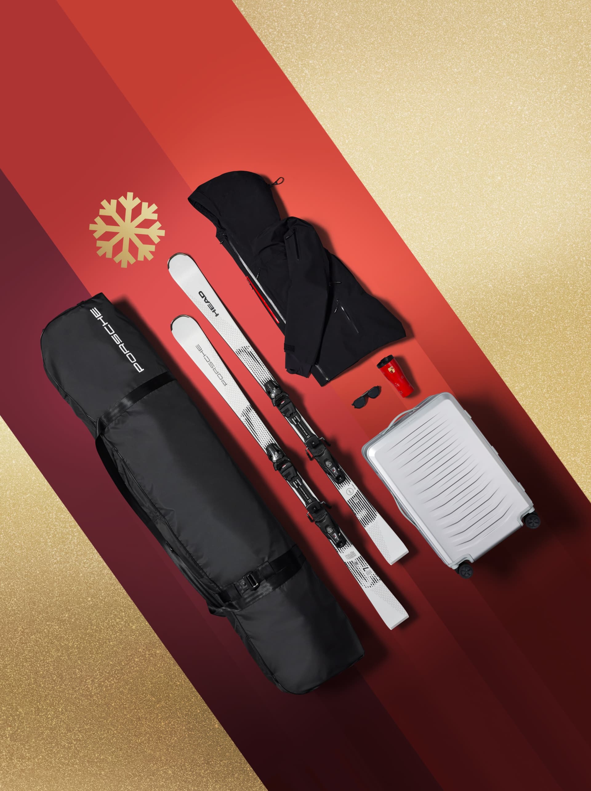 Motivo navideño con esquís, chaqueta, maleta y algunos accesorios