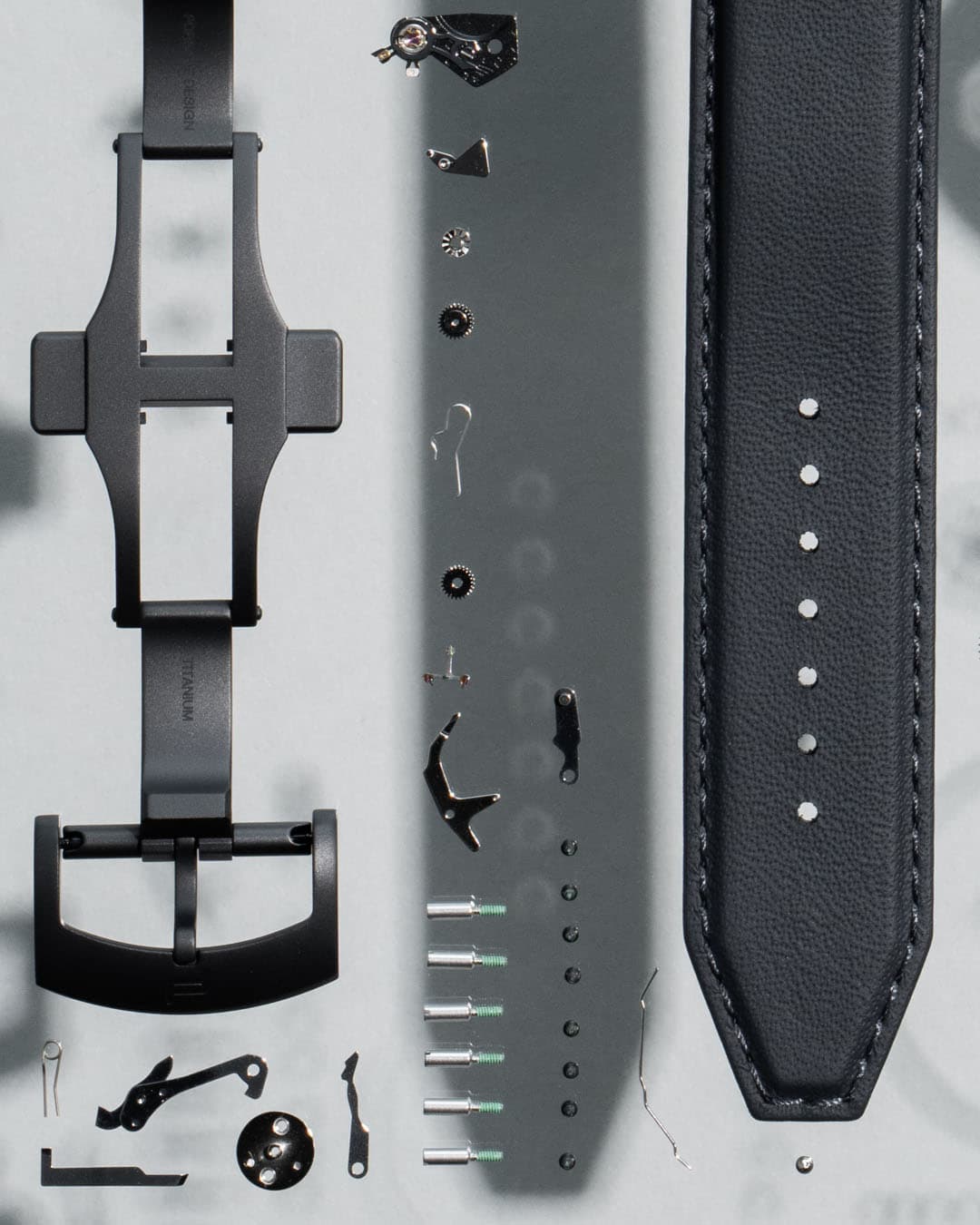 Close-up shots of a deconstructed watch, focus on the straps