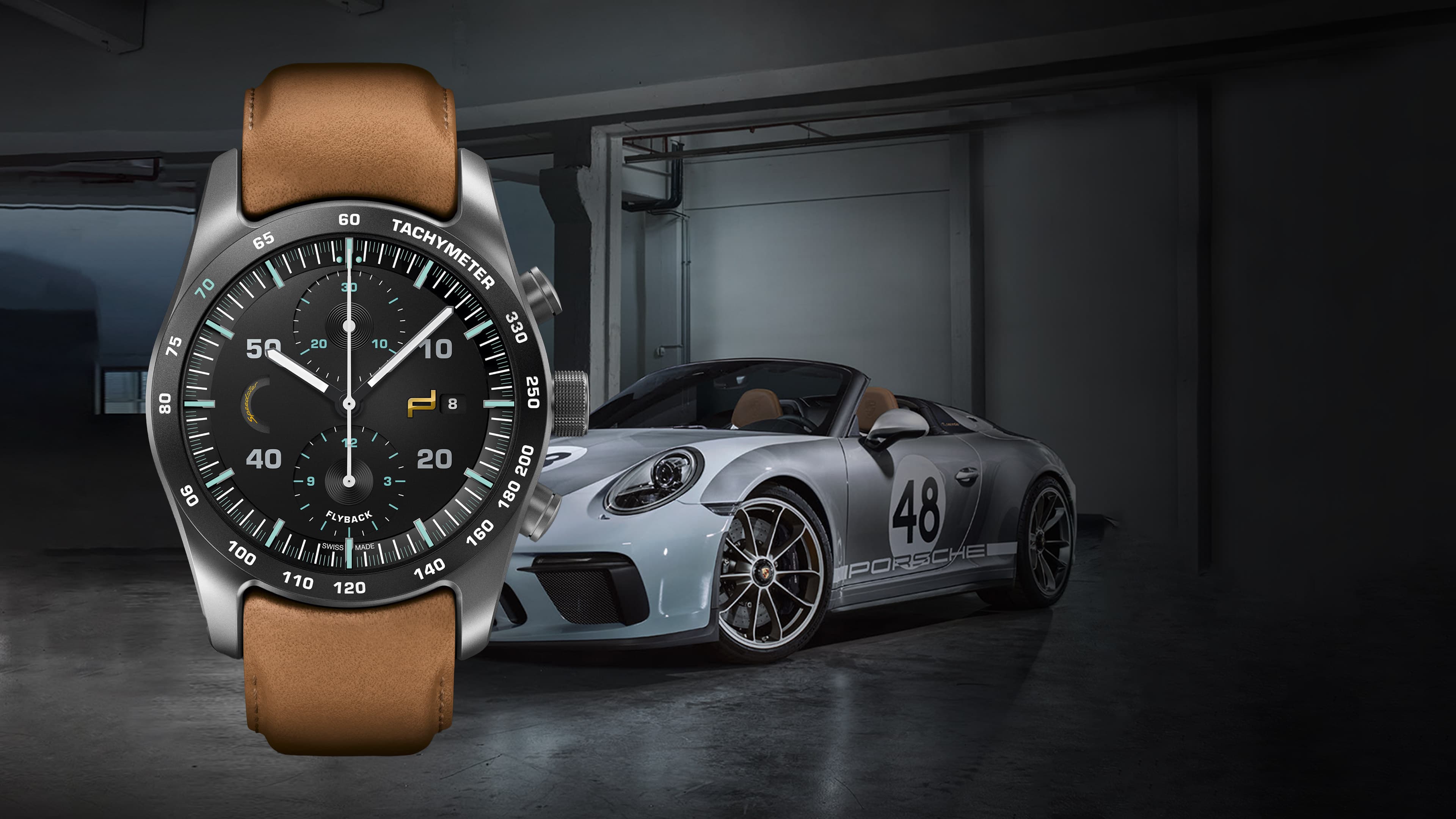 Pictured is the Chronograph 911 Speedster Heritage Design Porsche wristwatch with a brown strap and a blue Porsche 911 Cabrio behind it