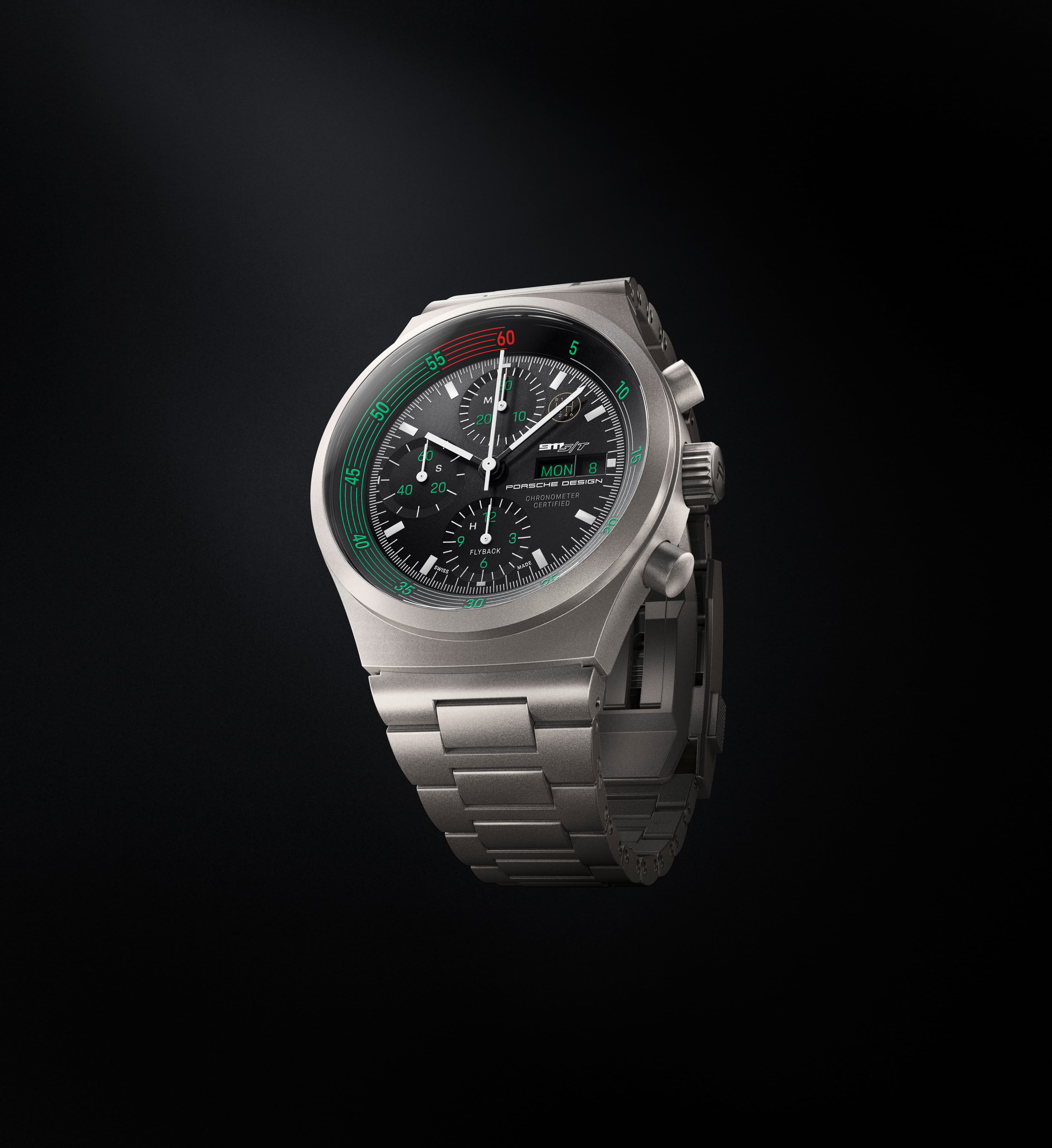 Silberne Porsche Design Chronographenuhr mit schwarzem Zifferblatt, grünen Akzenten und Metallarmband auf Schwarz