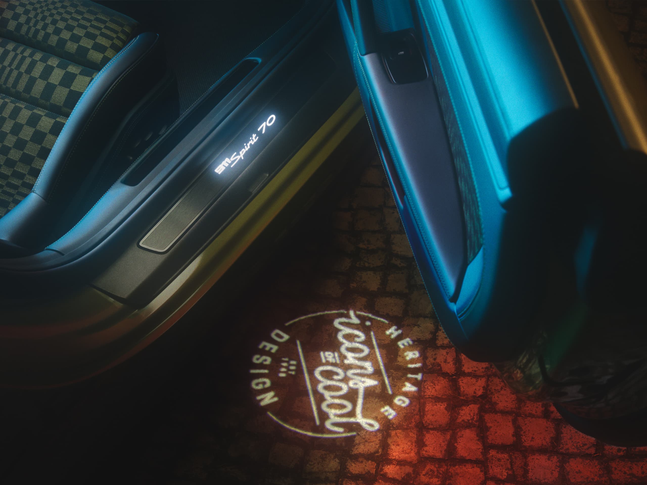 Opened passenger door of the Porsche 911 Spirit 70 with Icon of Cool light projection on the floor
