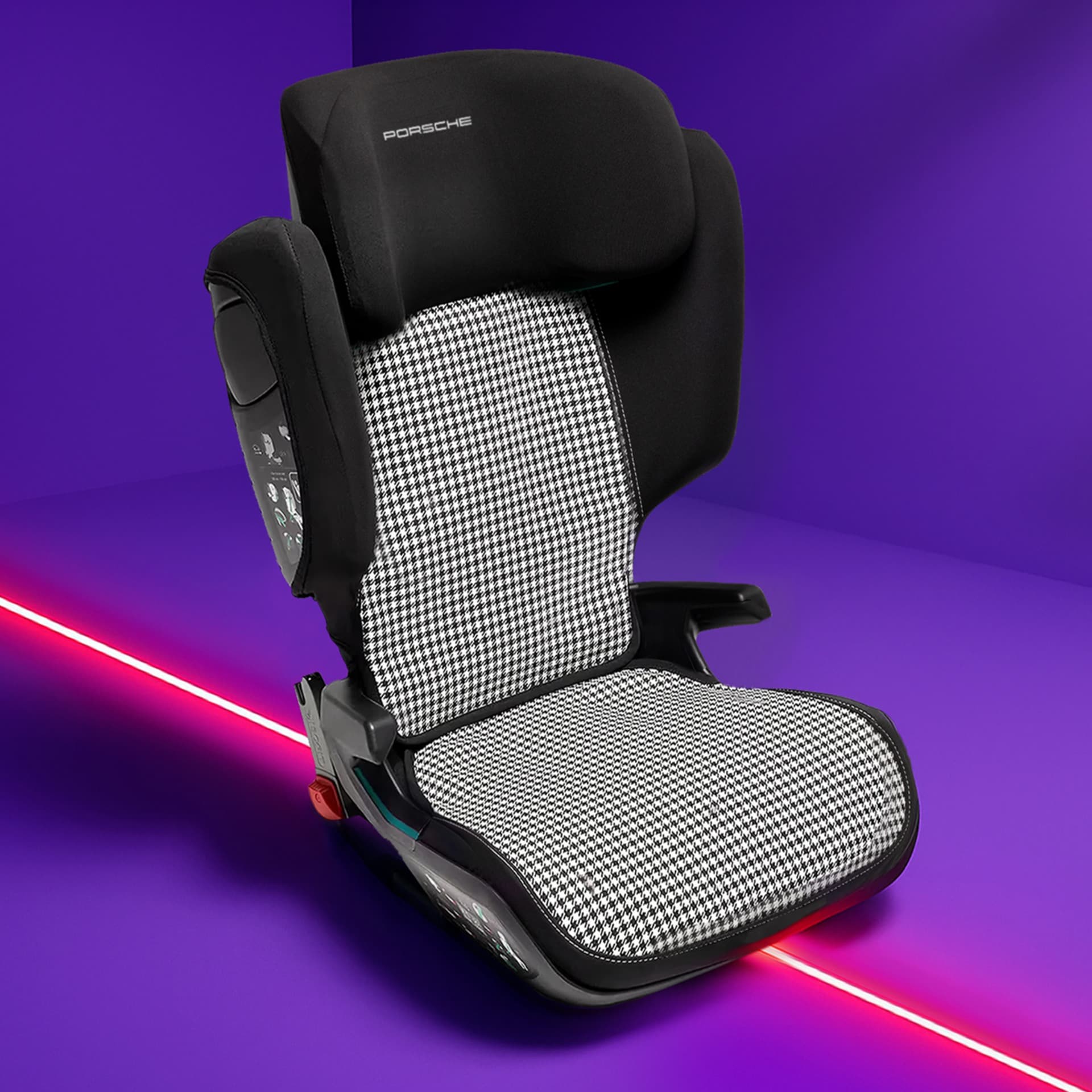 Black and white houndstooth Porsche child seat on a vibrant purple background with a red diagonal line.