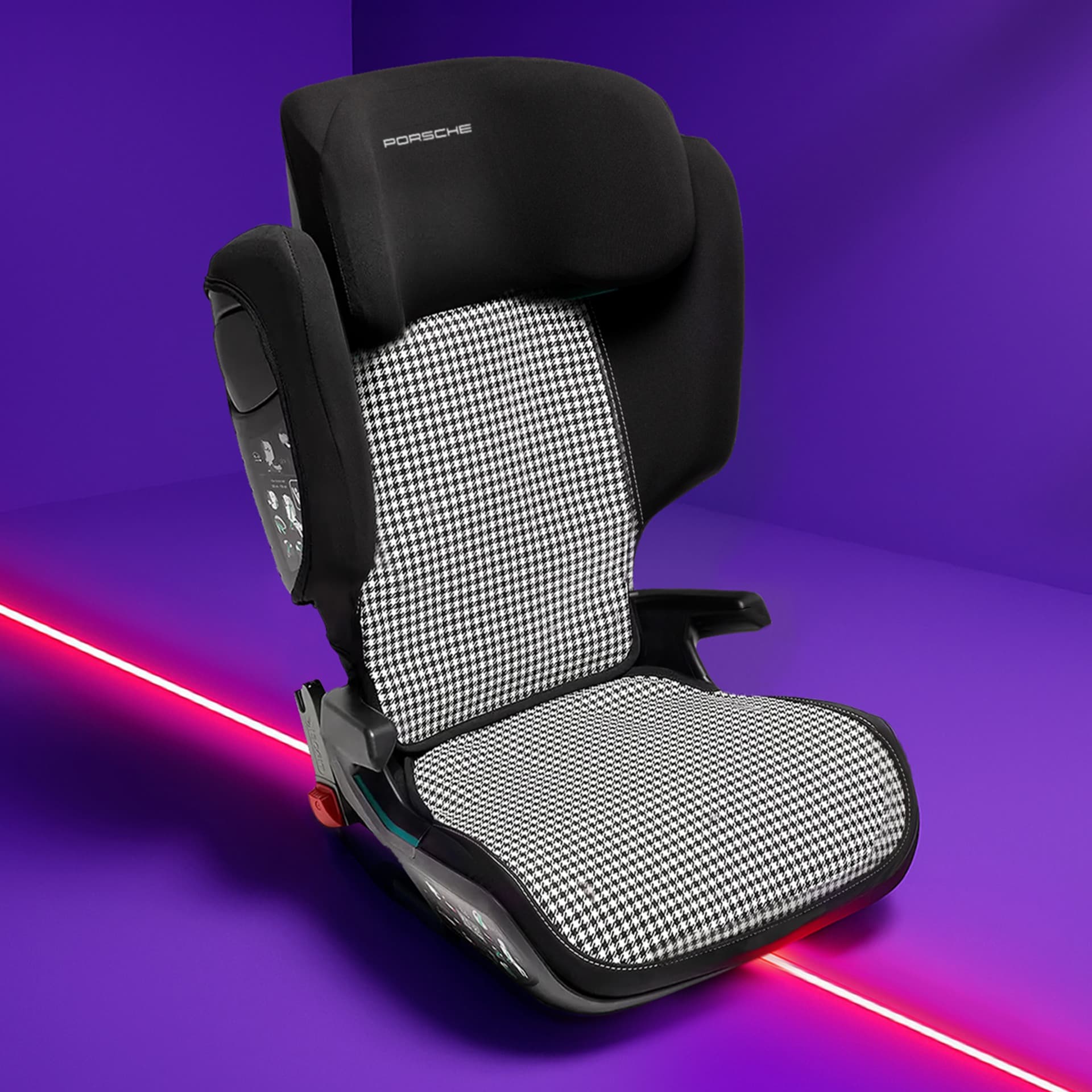 Black and white houndstooth Porsche child seat on a vibrant purple background with a red diagonal line.
