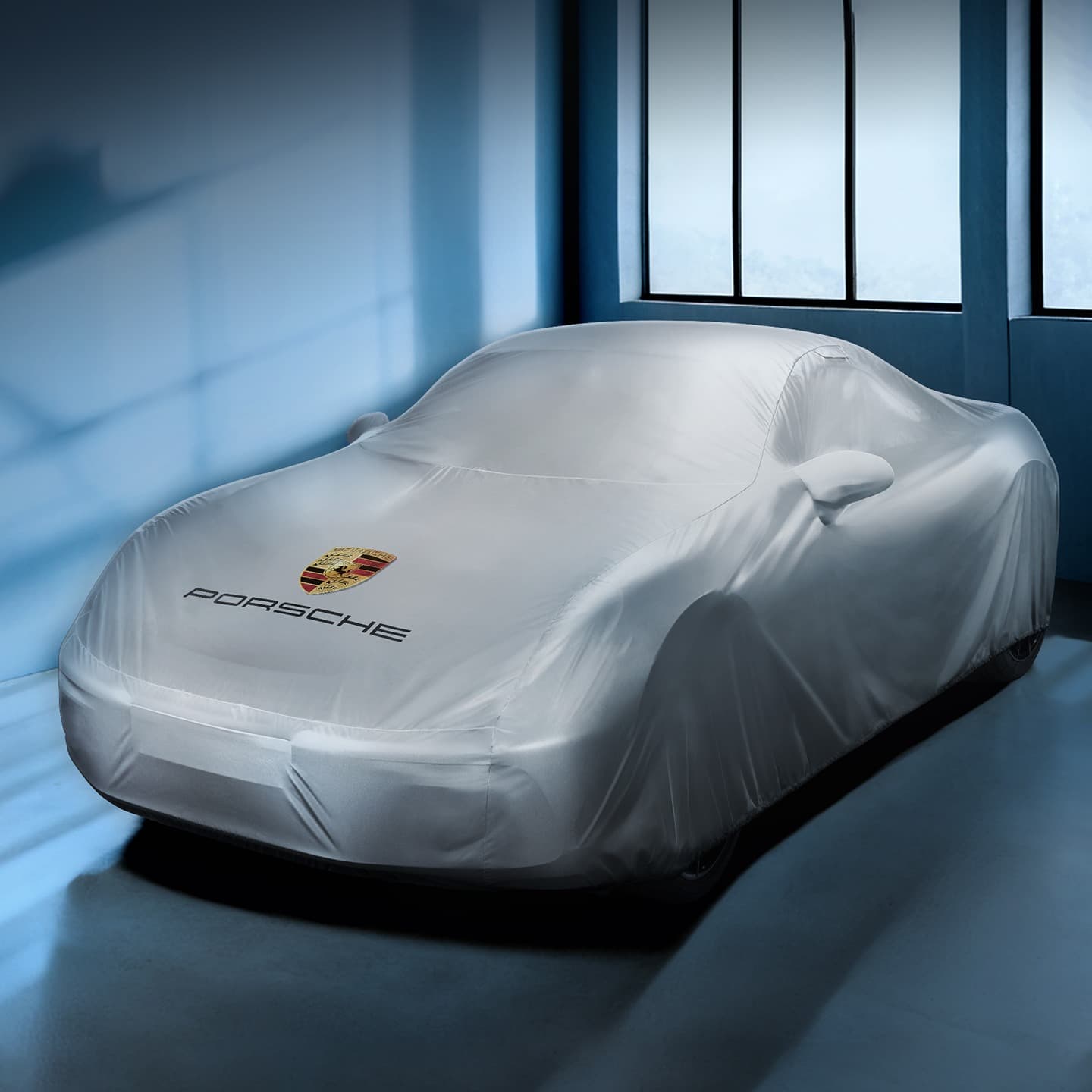 Car with a car cover in a blue environment