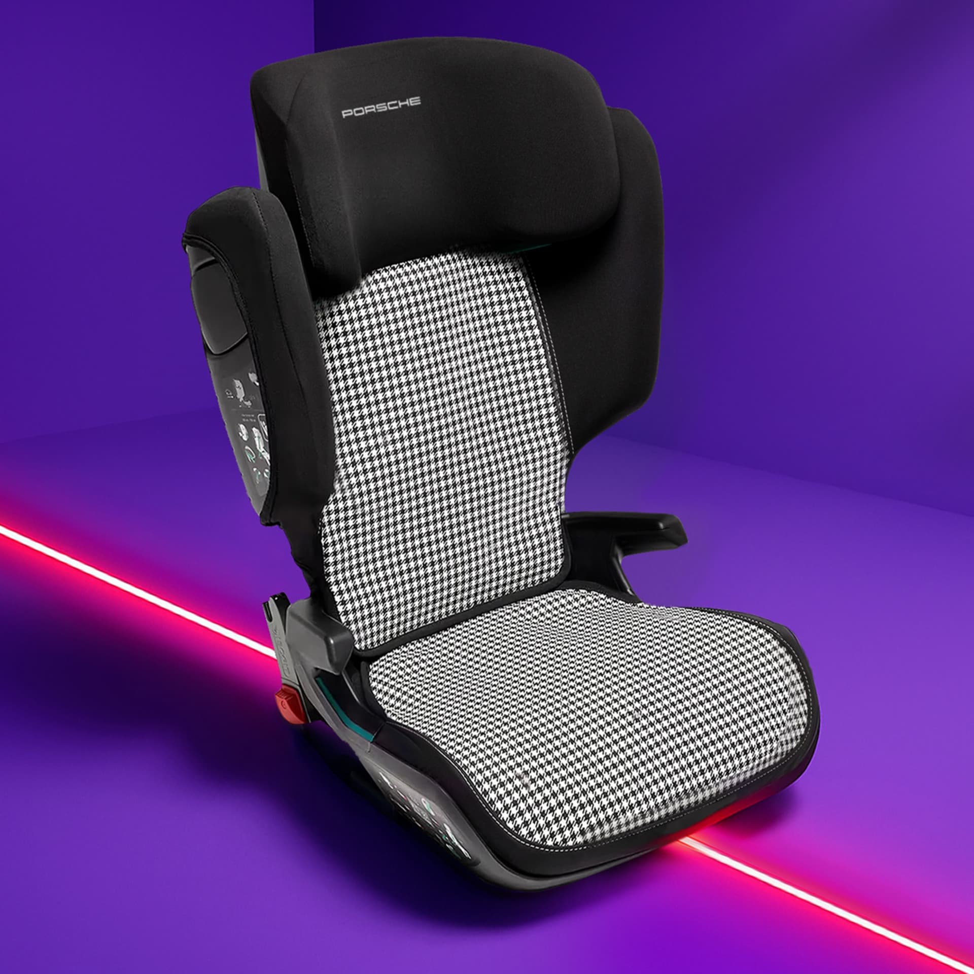 Black and white houndstooth Porsche child seat on a vibrant purple background with a red diagonal line.
