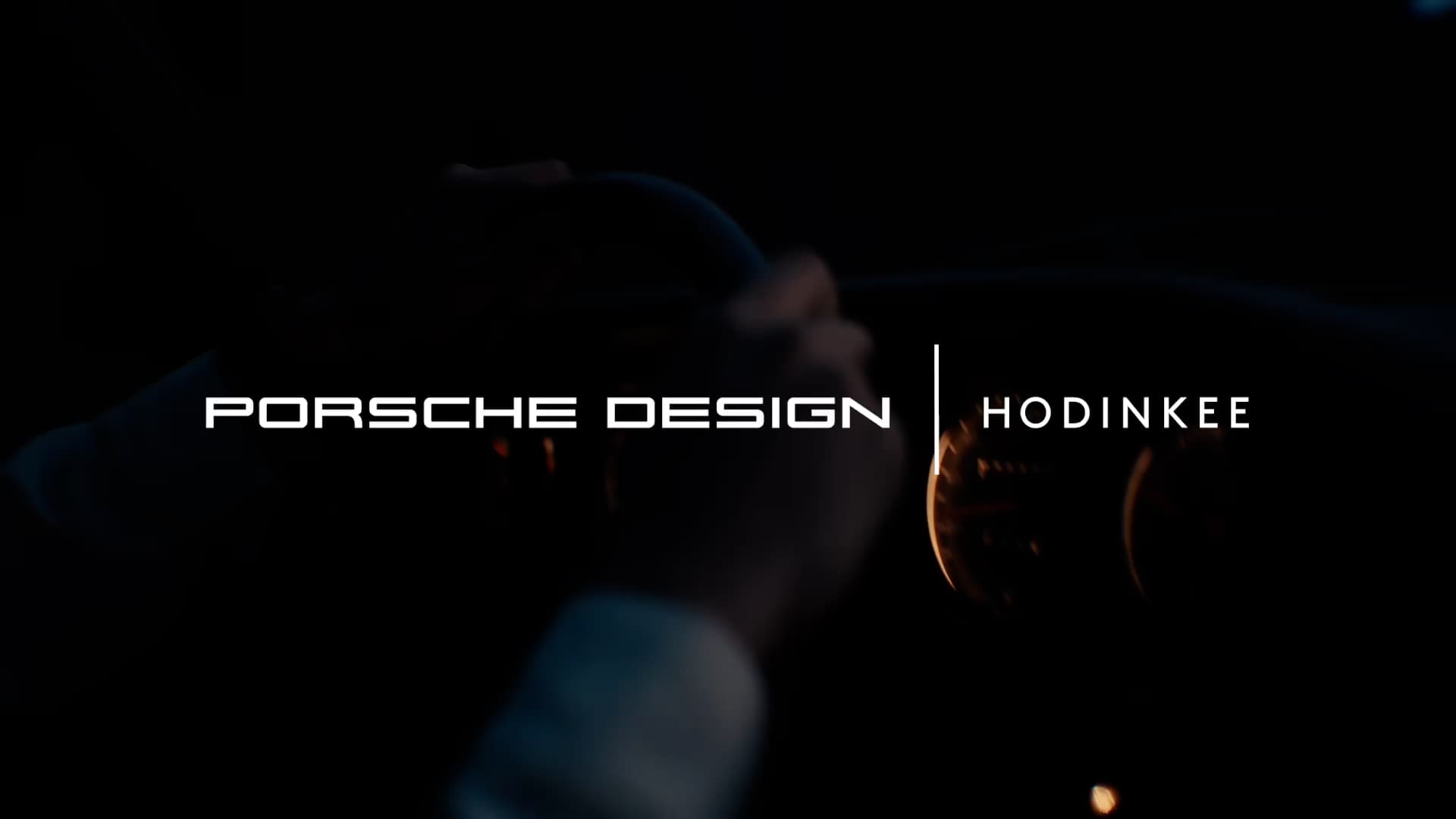 White Porsche Design Hodinkee lettering on a dark background