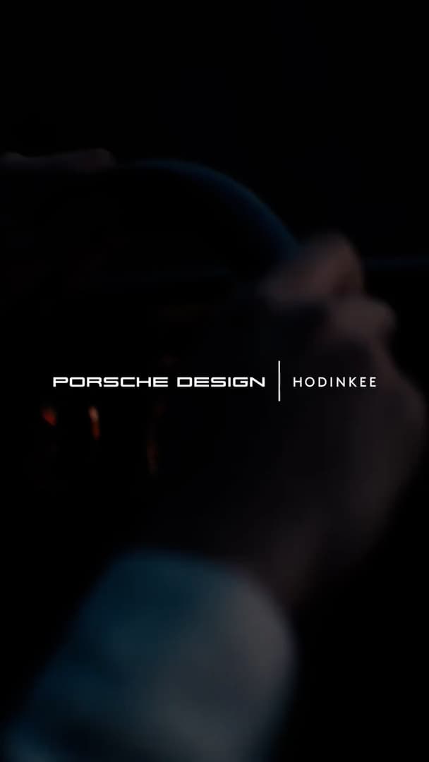 White Porsche Design Hodinkee lettering on a dark background