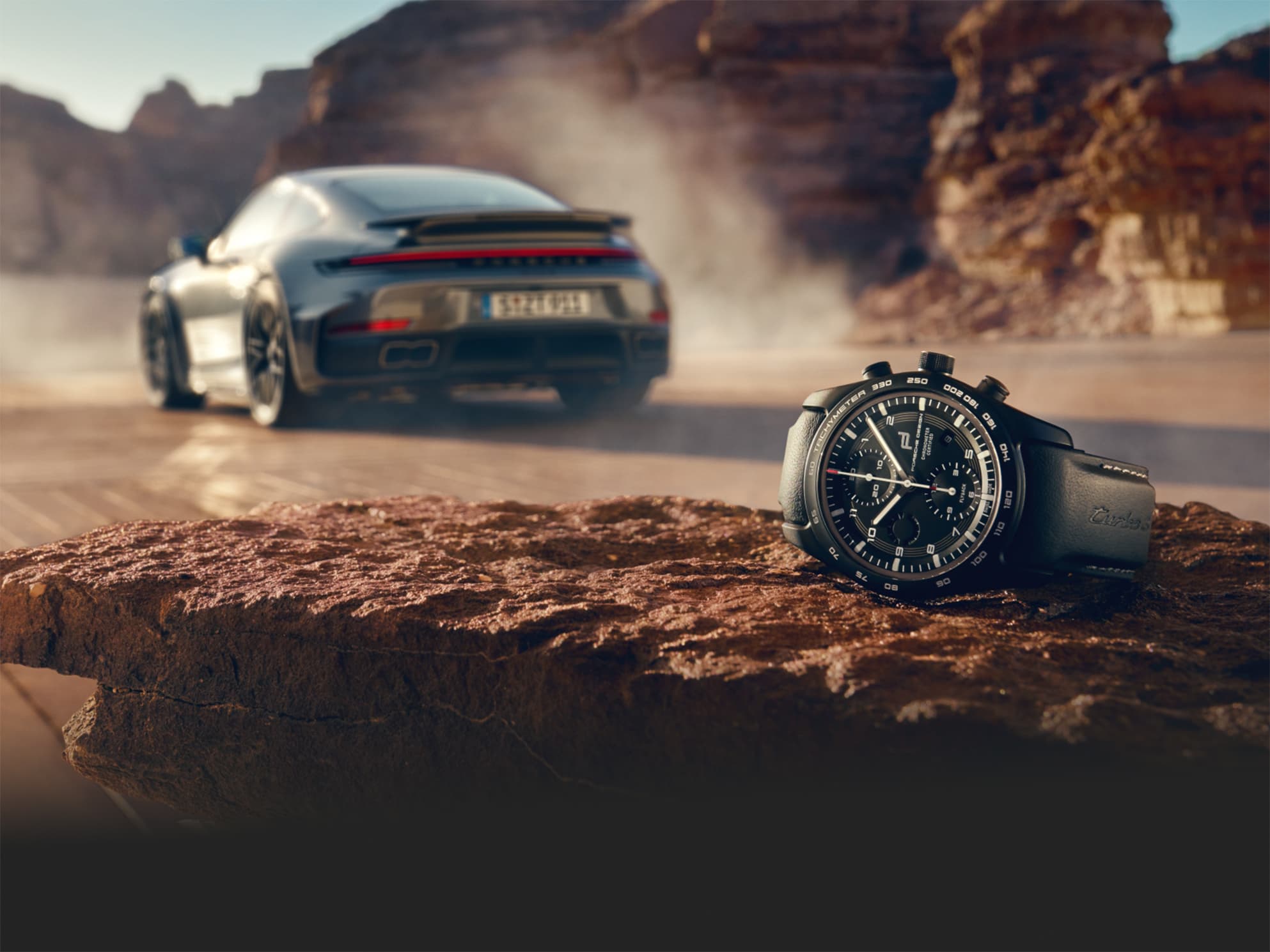Image shows the custom-built Chronograph 911 Turbo S in the front and a Porsche 911 Turbo S in the background