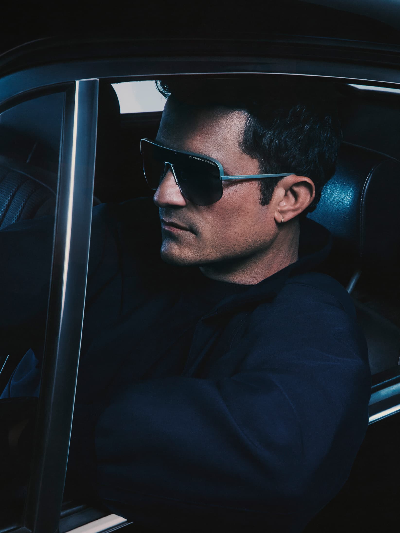 Orlando Bloom wears the Iconic – 911 Targa 60Y sunglasses from the Streamline series by Porsche Design